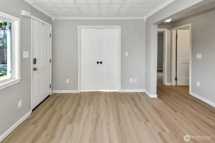 Living room looking at french doors that are closed into office space