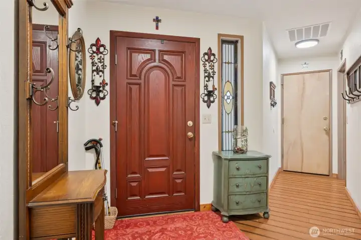 Inside the front door. The door at the end of the hallway is the office.