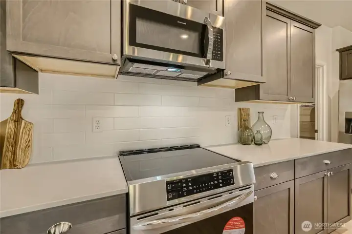 Induction stove included.   Photos are representation as the home is under construction.