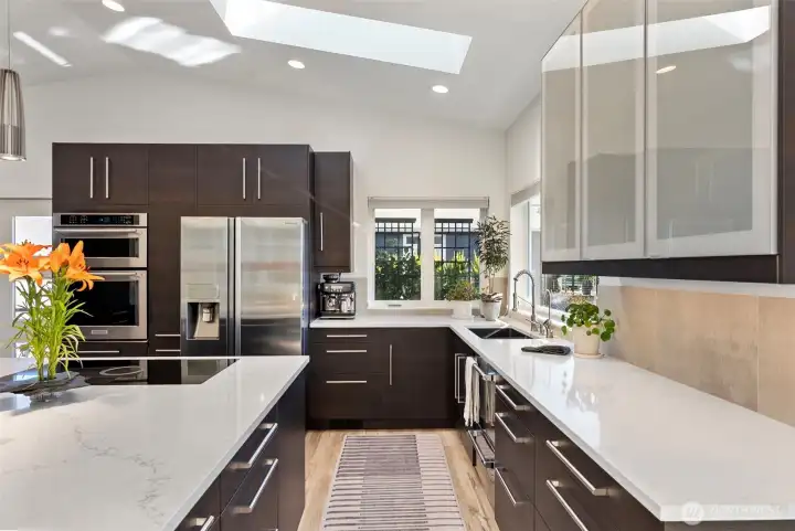 Light in color solid surface counters for that clean and easy to maintain kitchen amenity.