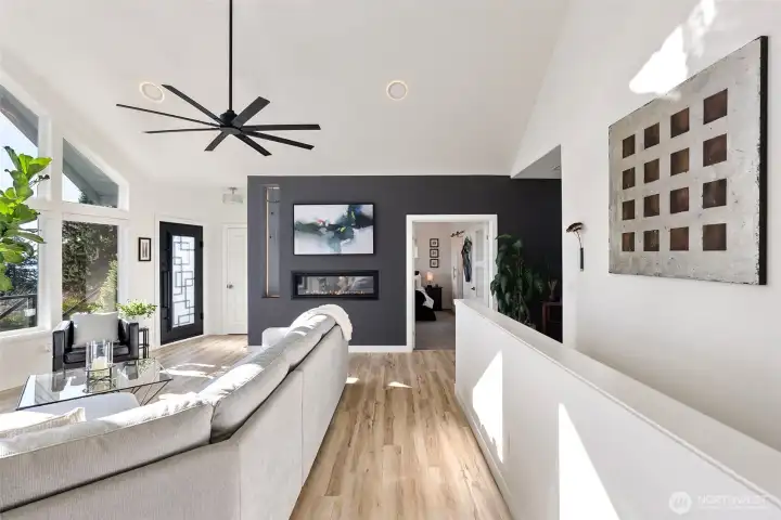 View looking down to the two sided propane fireplace. Enjoy from the Great room or from the Primary bedroom.