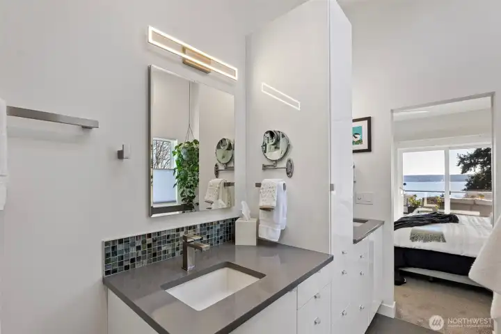 Don't miss the cabinet style recessed mirrors above each sink. Storage at your fingertips and electrical receptacles within for necessary charging.