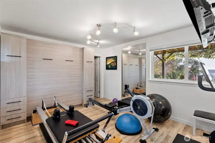 Bedroom 3 lower (main level) Large and extra deep walk in closet, Murphy bed which stays and a large niche not shown. This room is currently used as the view work out space. Just off this room is the separate entry vestibule for guests, home office or for patio use with views.