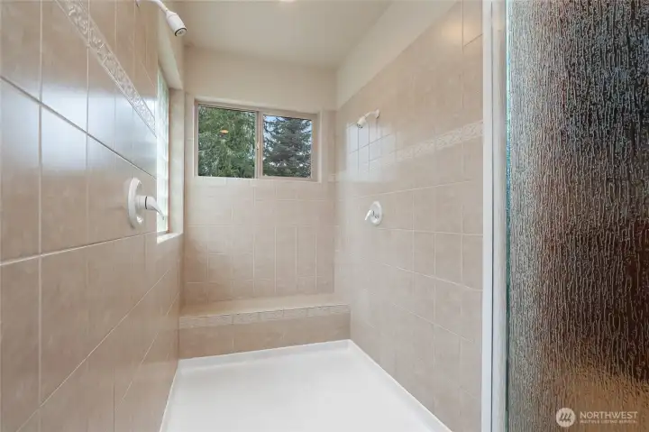 Double headed walk-in shower.