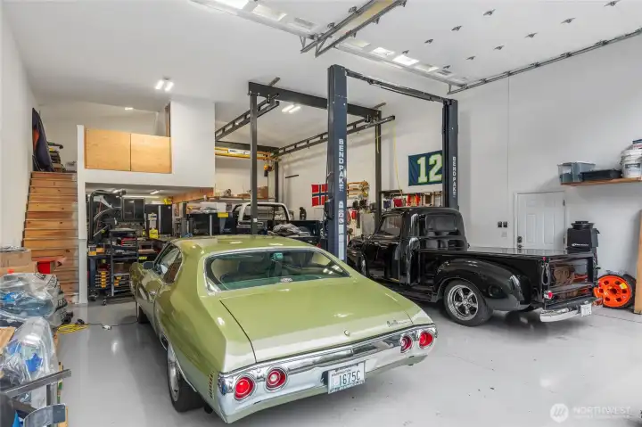 Shop features large doors, tall ceilings, a 196 sf mezzanine, and a 456 sf attic.