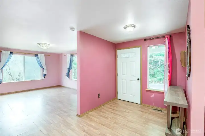 The living room is located to the right as you enter the front door