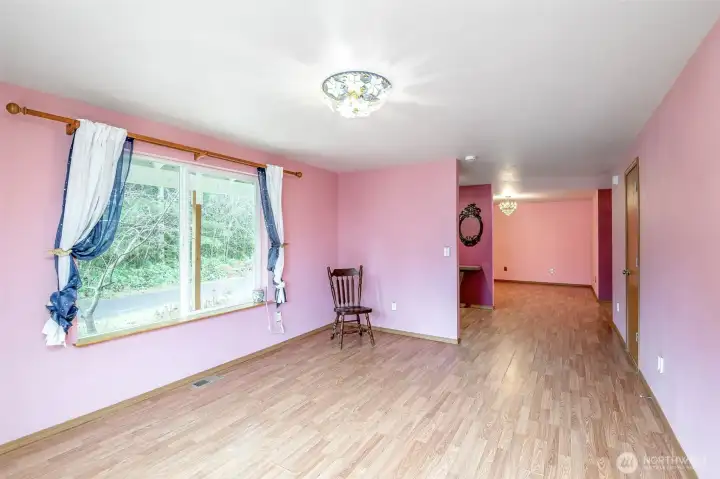 Another look at the living room with dining room at far end.