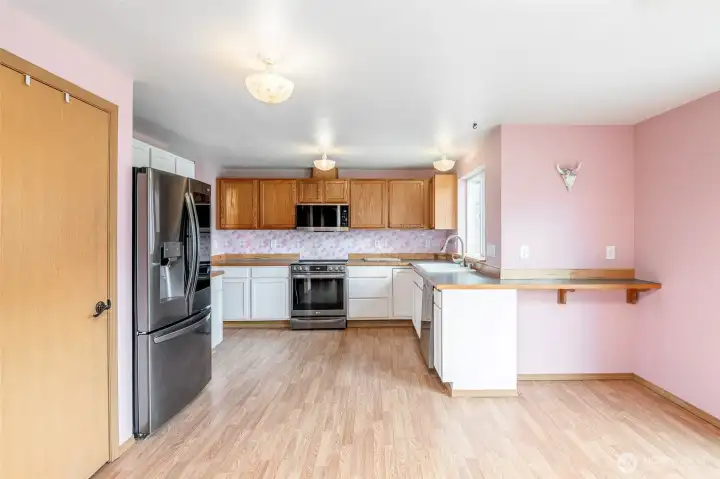 Pantry next to the refrigerator.