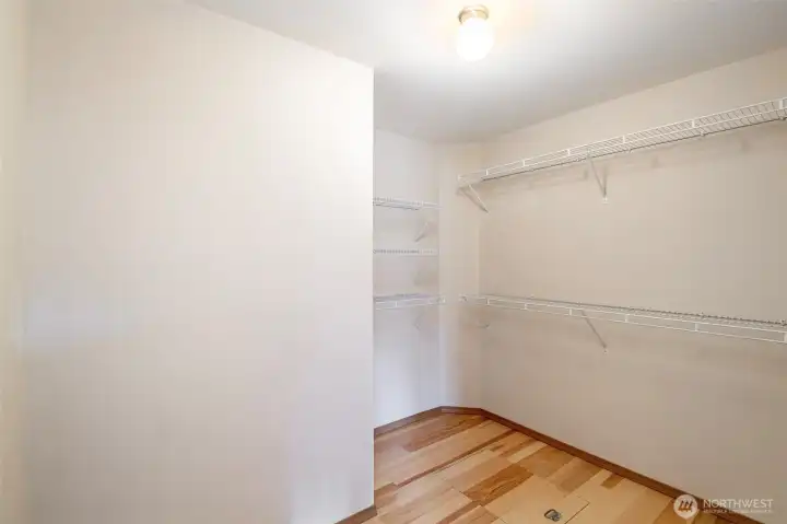 Walk in closet off of primary bedroom.