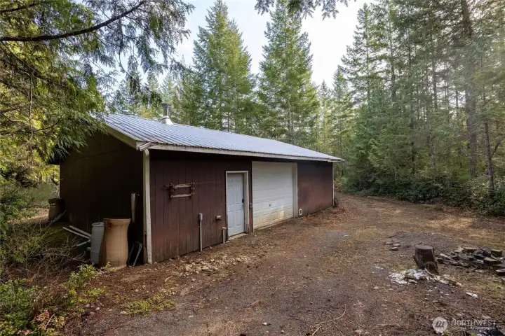 Wood Framed shop- Garage doors on both sides.