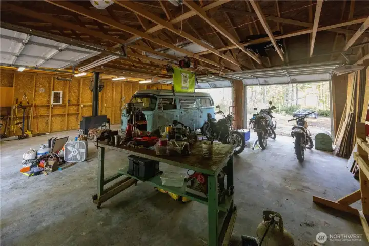 Wood Framed shop interior. Shop has 220, water, wood stove and overhead electric shop heater.