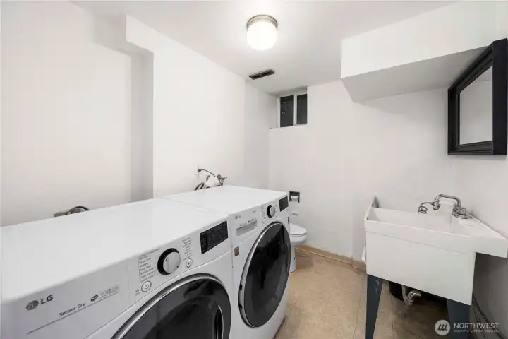 In unit laundry & powder room with a sink for convenience