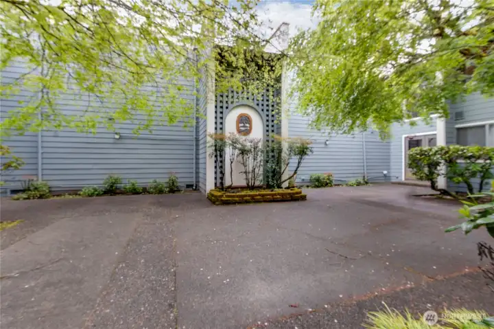 Welcome home! Enter through a beautiful garden area.