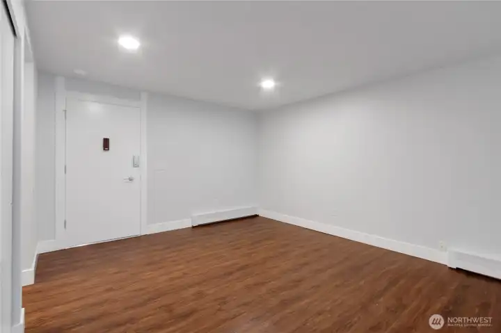 Living room area looking towards front entrance.