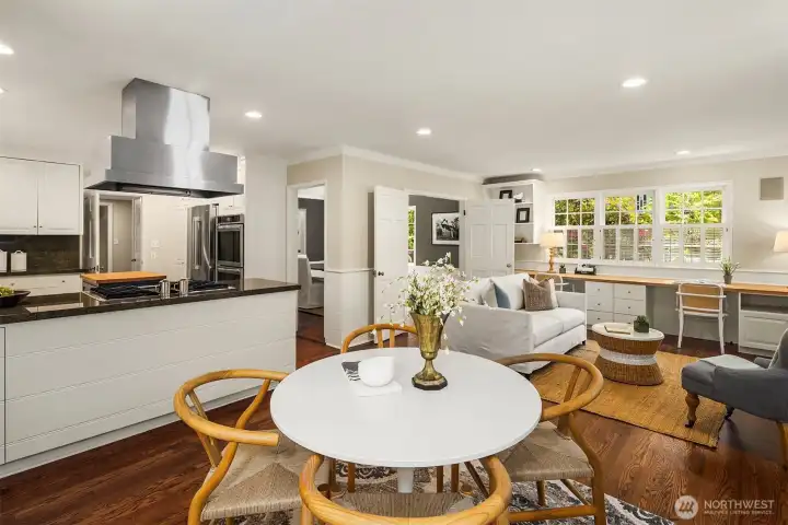 Perfectly positioned between the kitchen and family room, the light-filled eating area serves as a natural gathering place for everyday dining and conversation.