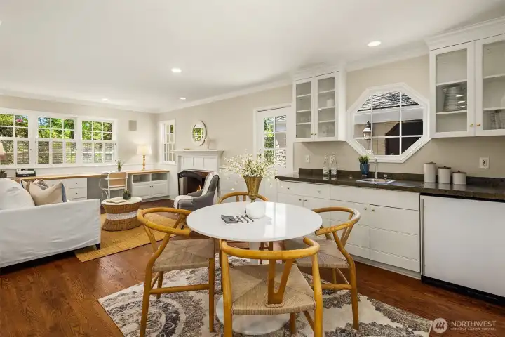 This area is complemented with a built-in wet bar and beverage fridge.