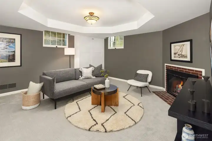 Comfortable and multifunctional, this lower-level room offers a cozy gas fireplace and integrated Murphy bed, creating a space that easily transitions between guest accommodations and everyday use.