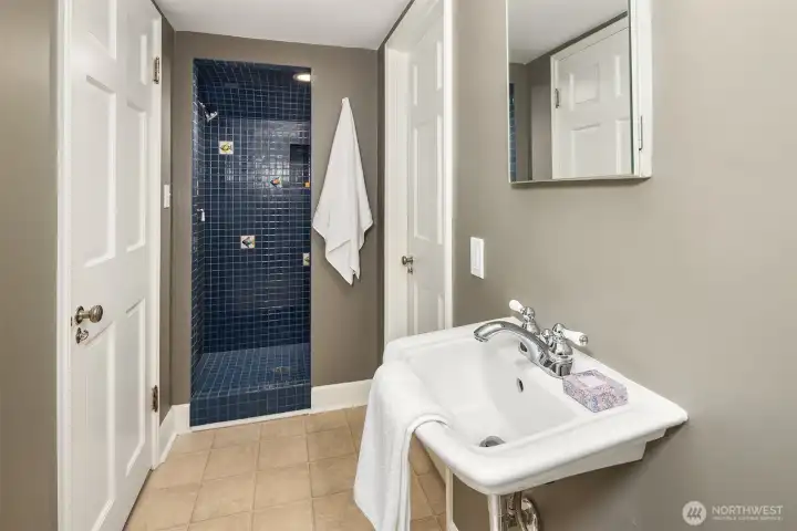The adjoining 3/4 bath enhances the versatility of this lower-level retreat, creating a private and comfortable space for overnight visitors.