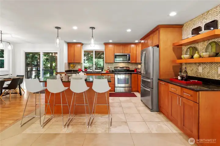 SS appliances, cherry cabinets, designer backsplash, island seating SS appliances, cherry cabinets, designer backsplash, island seating