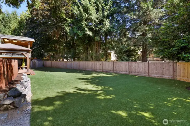 A fully 'turfed' back yard...volleyball net, bocce ball, soccer practice? Easy to maintain and green all year long. A fully 'turfed' back yard...volleyball net, bocce ball, soccer practice? Easy to maintain and green all year long.