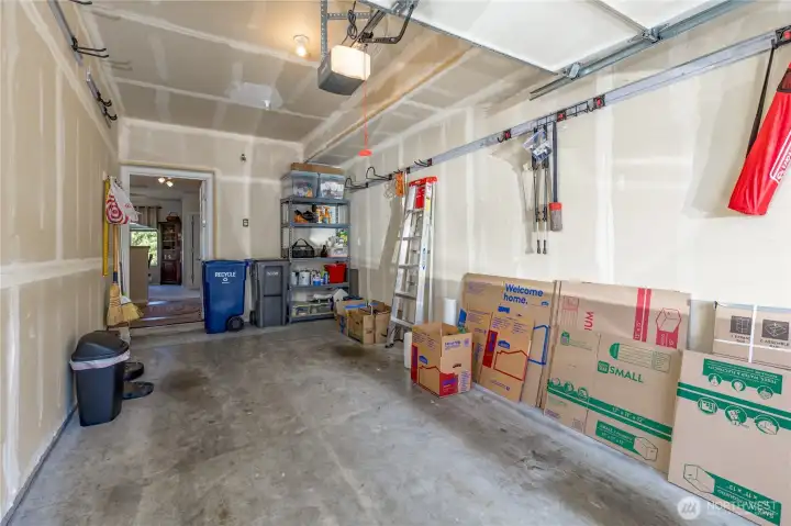 Attached garage with shelving and modular organization track system that stay!