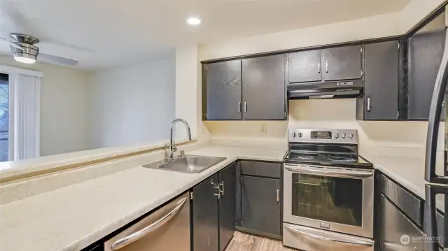 This angle showcases the flow of the kitchen into the dining space.