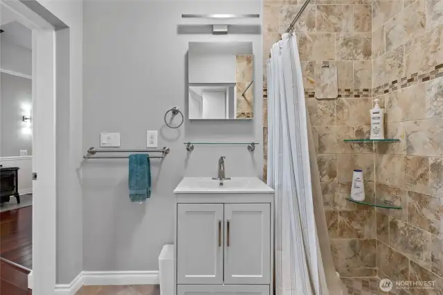 Guest Bath adjacent to Laundry Utilities on Manin floor