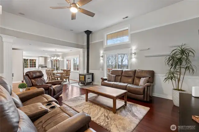 Cozy Living area with wood stove and treed views
