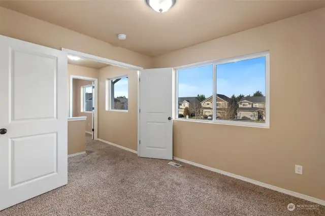 This is Bedroom #2 at the top of the stairway. A nice bedroom space with closet, this room could also serve as a great office space. Notice the french doors.