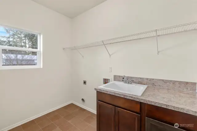 Large laundry with tile floors.