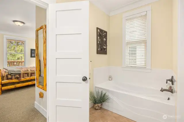 Primary Bath features a full size soaking tub.