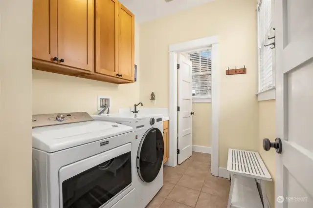 Mudroom and Laundry off the kitchen with wash sink and also a half bathroom.