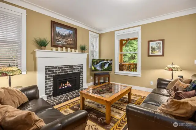 The Living room is large enough for 2 sofas and features a real brick fireplace surround.