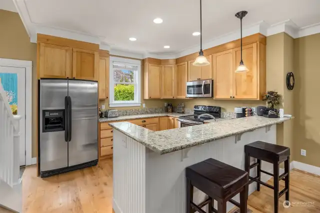 These real maple wood cabinets are stunning. Granite counters and stainless appliances.