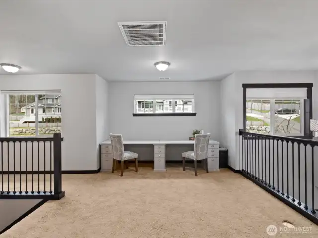 A versatile upstairs landing offering endless possibilities—create a cozy reading nook, a play area, or a secondary lounge space.