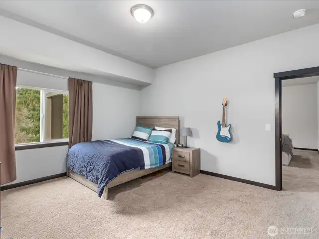 A private and spacious flex room complete with a closet and ensuite bathroom, offering endless potential.