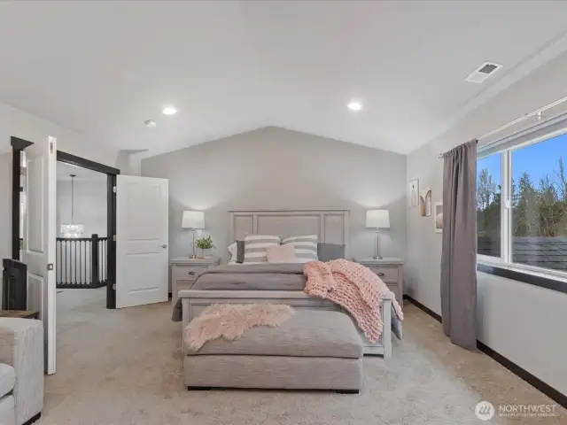 Primary Bedroom with Ensuite. A true sanctuary! This luxurious primary suite features a spacious layout, serene views, and a spa-like ensuite with a soaking tub, dual vanities, and a walk-in shower.