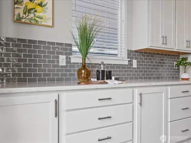 Plenty of counter and cabinet space.  Beautiful tile backsplash!