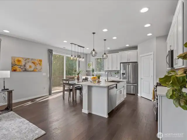 Beautiful Chef's Kitchen features stainless steel appliances, quartz countertops and walk-in pantry.