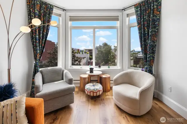 Bay Windows with swivel chairs to grab that book you have been meaning to read or just gaze out at wonderful water views and people watch city life!