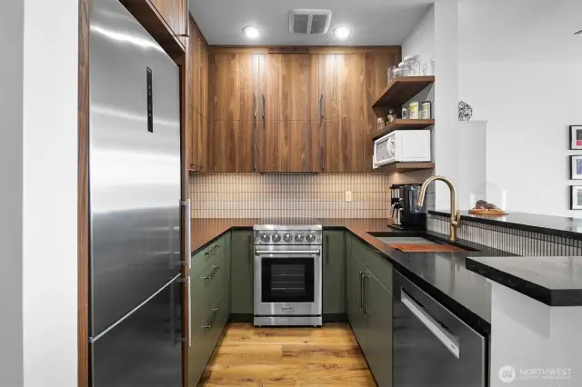 Thoughtful design makes this kitchen live large! Every piece of space has a use! Granite countertops with Yohen/INAX tile backsplash.