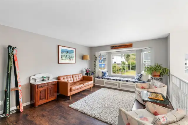 Upstairs living space with built-in window seat.