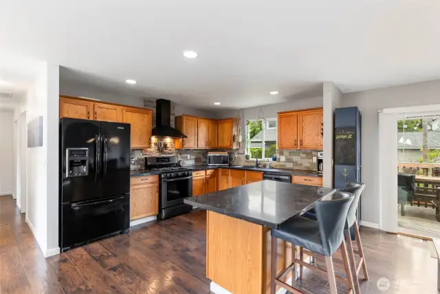 Spacious kitchen with gas stove.