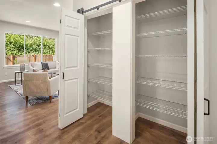 Custom double-sized pantry with barn doors
