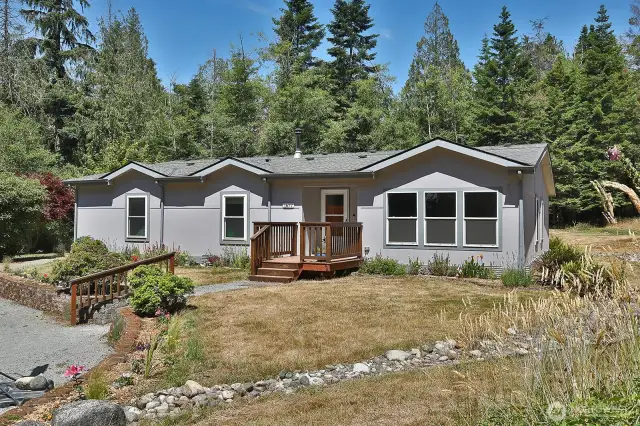 Let's go inside and check out the spacious open floor plan. The three windows to the right of the front door belong to the dining room. The two windows to the left each belong to rooms that could be offices or bedrooms.