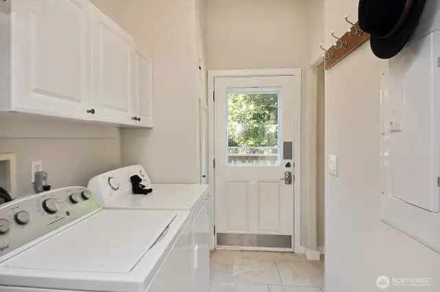 On the other side of the kitchen is an entrance and small deck. Your back is to the half bath.