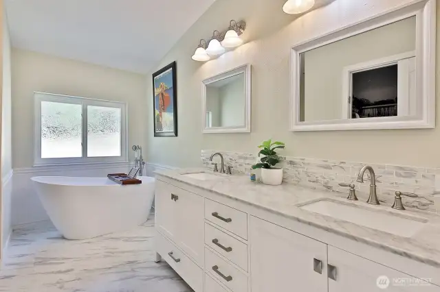 Luxurious Primary Bath with a soaking tub and walk-in closet.