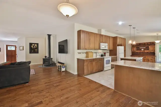 Let's go check out the 2nd Bedroom and 2 Flex Rooms via the hallway beyond the wood stove and to the right.