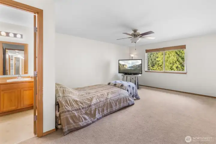 Main floor primary bedroom w/ lovely views of Blue Lake