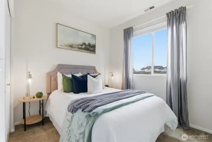 Main floor bedroom is roomy and convenient.